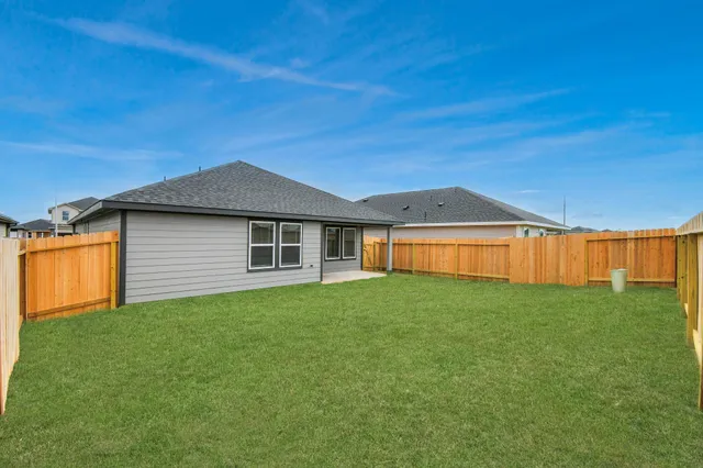 a backyard of a house with lots of green space