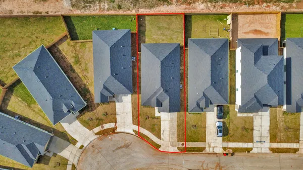 an aerial view of houses with outdoor space