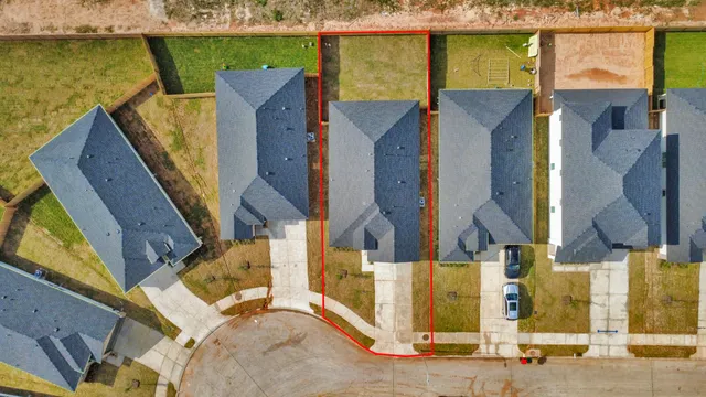 an aerial view of houses with outdoor space