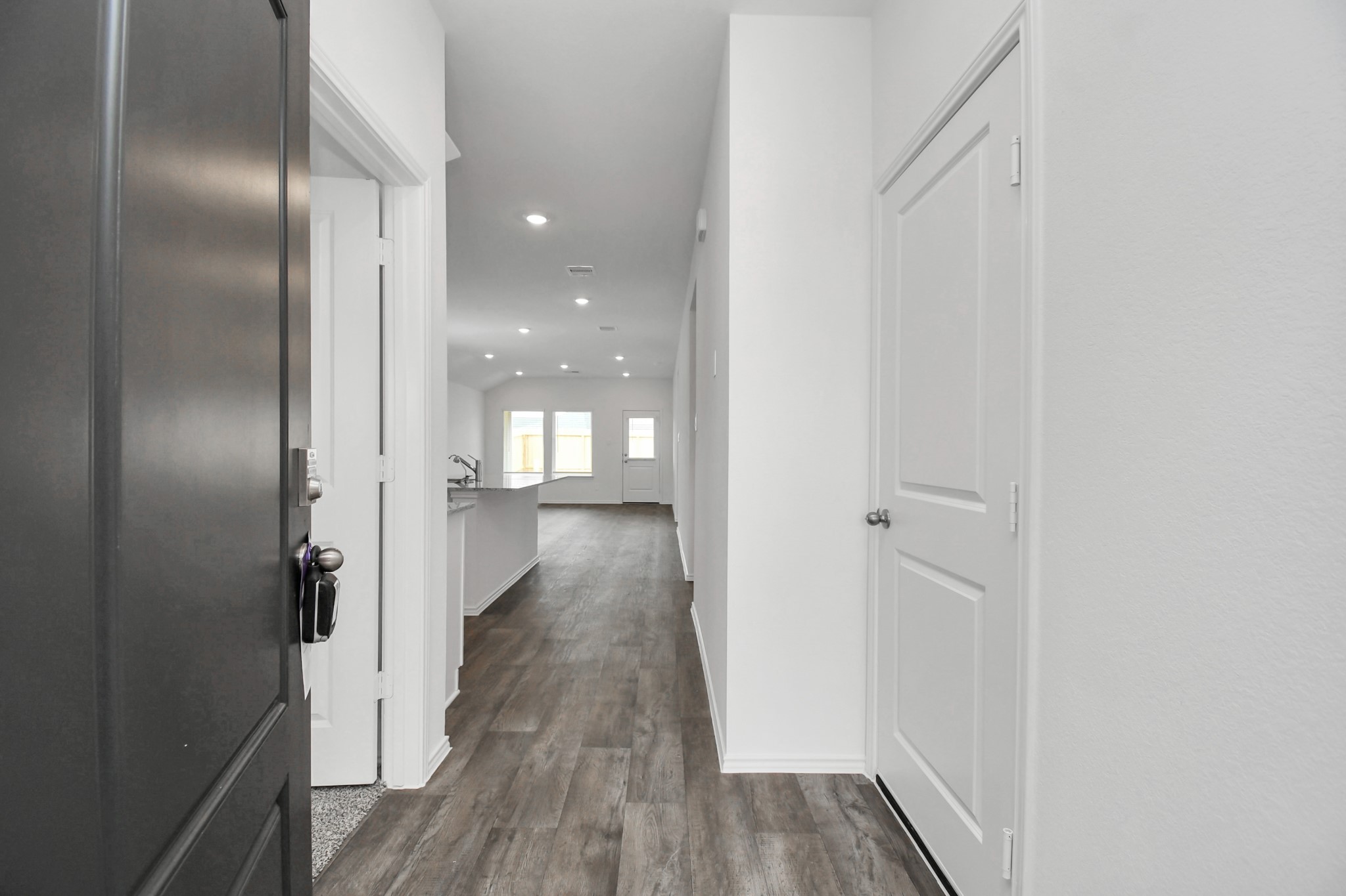 3822 Zoeys Way Fulshear, TX 77423 - Photo 10 of 37 a view of a hallway with wooden floor