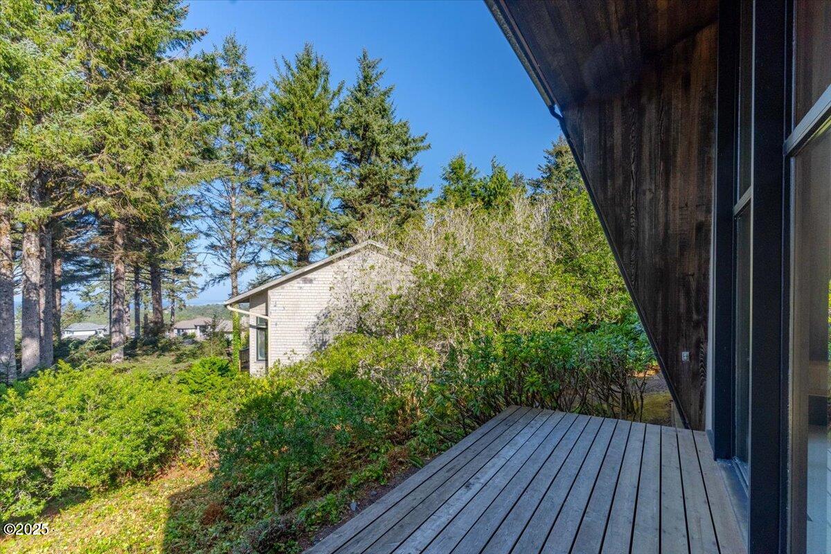 110 Ridge Crest Road Gleneden Beach, OR 97388 - Photo 15 of 72 a backyard of a house with lots of green space