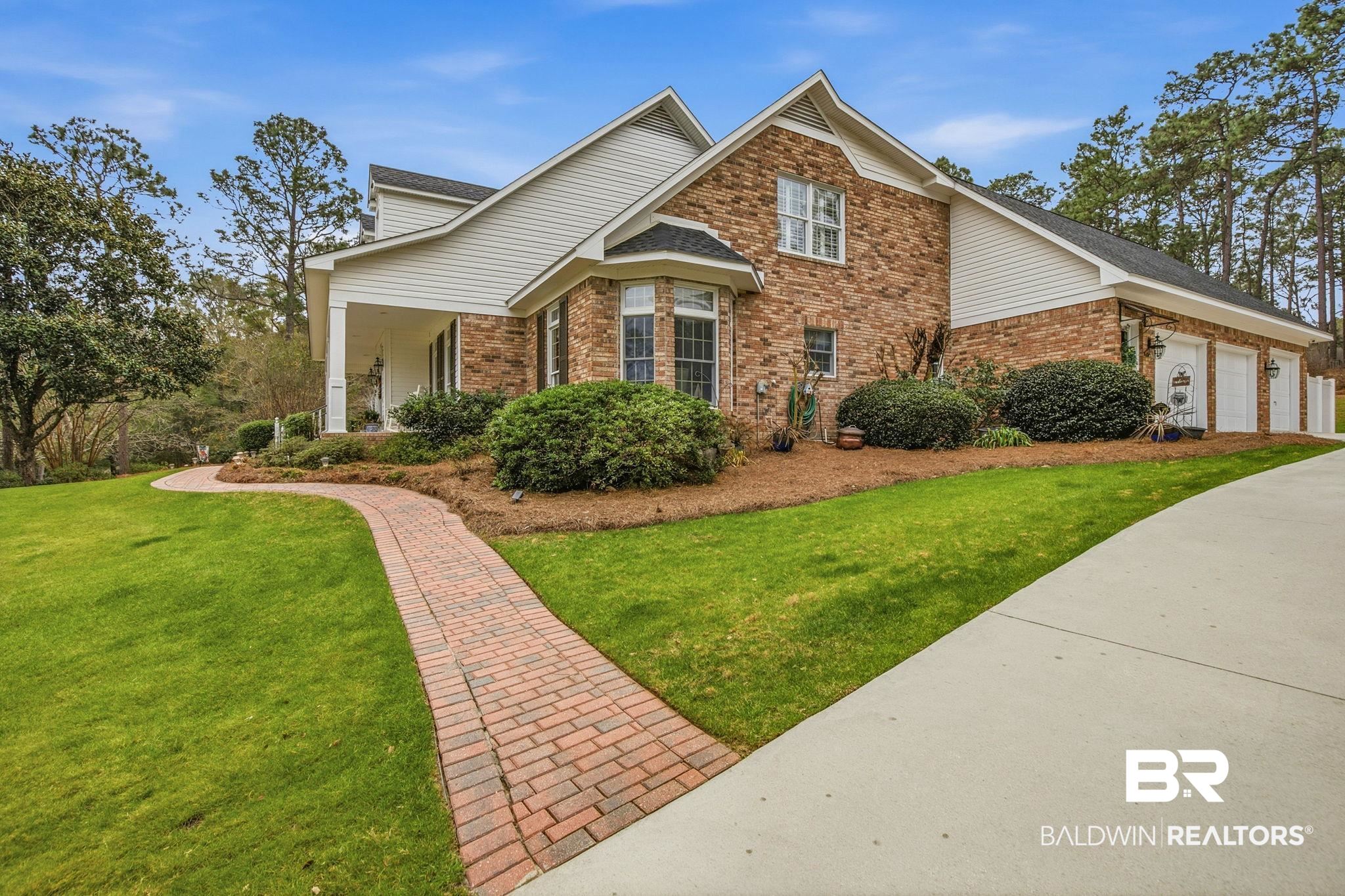 31515 Rhett Drive Spanish Fort, AL 36527 - Photo 4 of 100 This yard has been beautifully maintained with brick walkways to the front porch and to the pool area