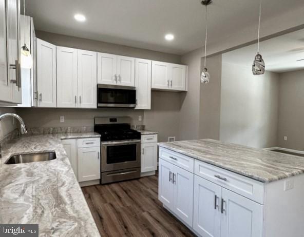 1245 Old Lake Road Newfield, NJ 08344 - Photo 12 of 34 a kitchen with granite countertop cabinets stainless steel appliances and a sink
