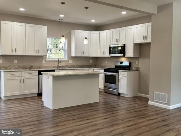 1245 Old Lake Road Newfield, NJ 08344 - Photo 10 of 34 a kitchen with granite countertop a sink stainless steel appliances and cabinets