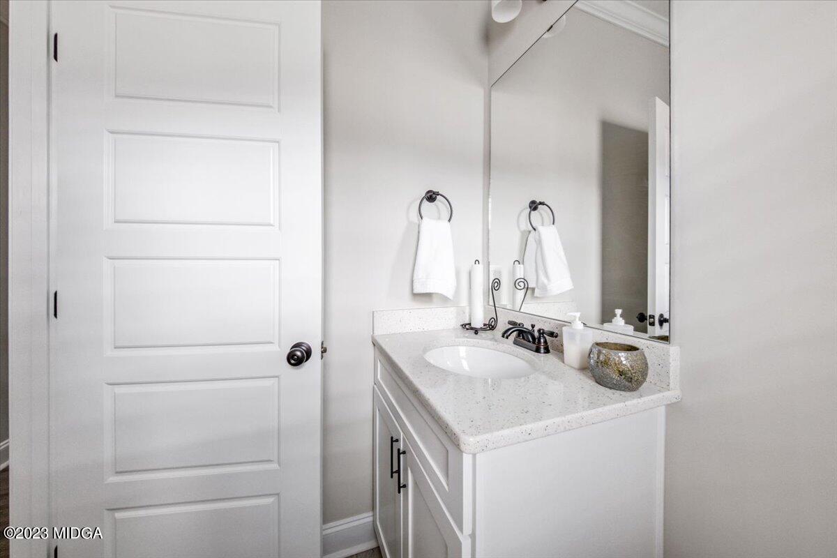 208 Carters Way Forsyth, GA 31029 - Photo 11 of 22 a bathroom with a sink and a mirror