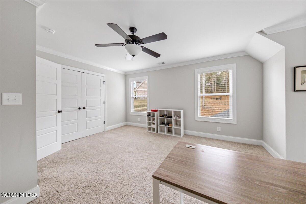 208 Carters Way Forsyth, GA 31029 - Photo 16 of 22 wooden floor in an empty room with a window