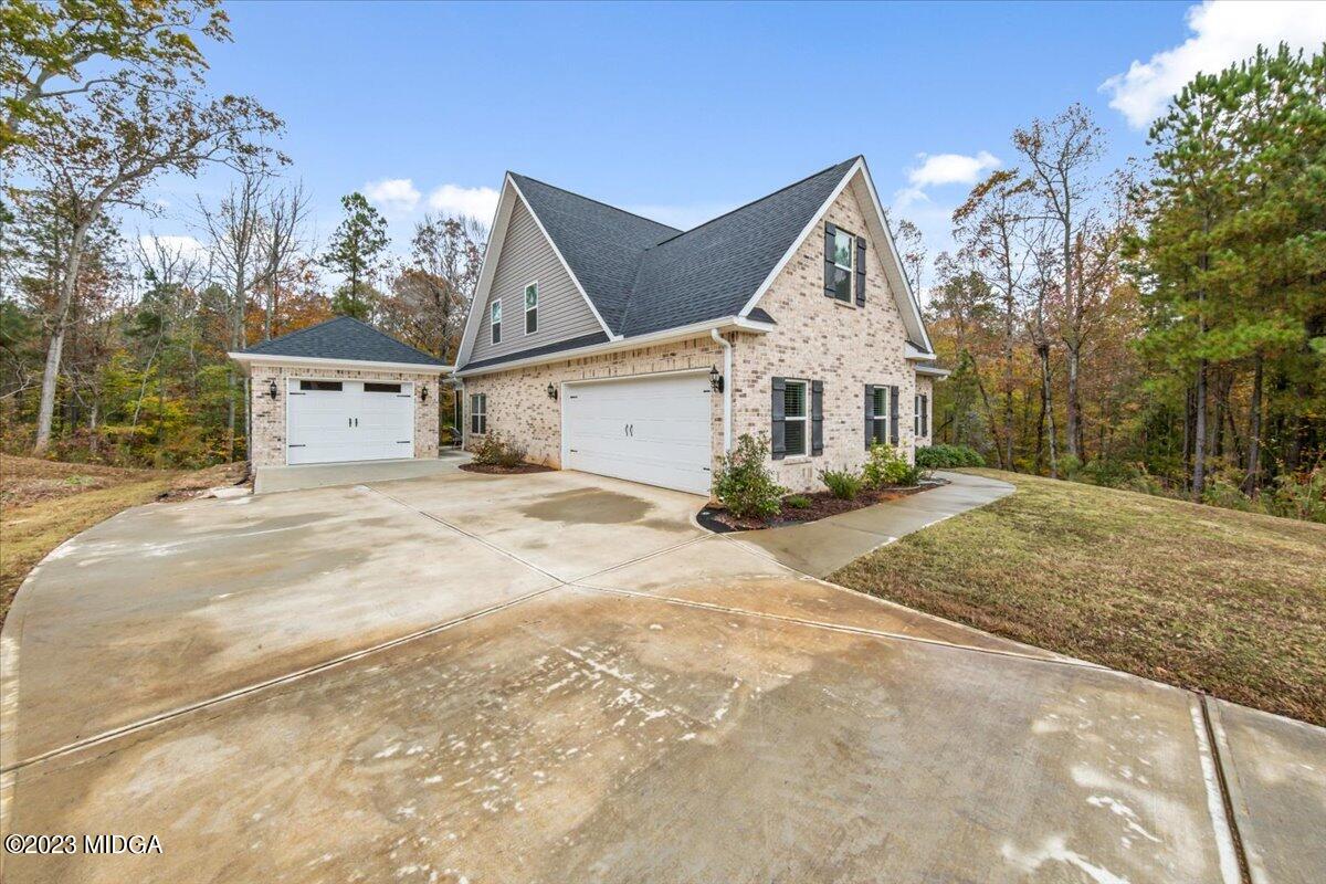 208 Carters Way Forsyth, GA 31029 - Photo 2 of 22 a view of a white house with a large space in front of it