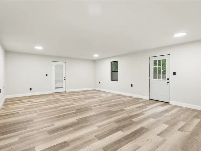 a view of a livingroom with wooden floor
