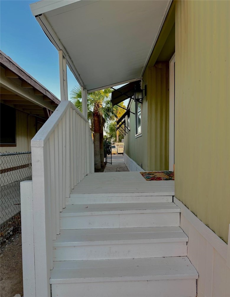 1395 Lause Road Bullhead City, AZ 86442 - Photo 3 of 34 Covered entry porch with white railing
