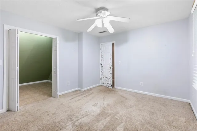 an empty room with a bathroom