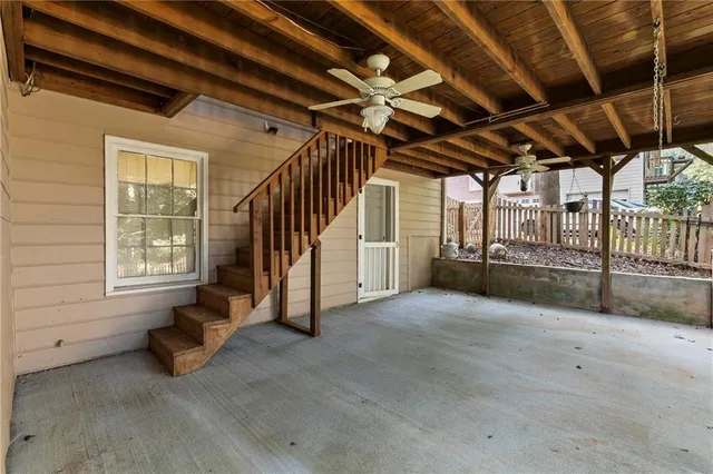 a view of an empty room with windows