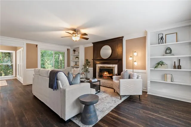 a living room with furniture and a fireplace