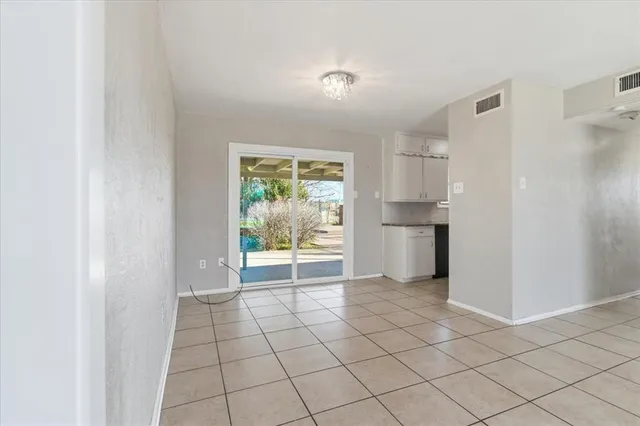 a view of an empty room and window