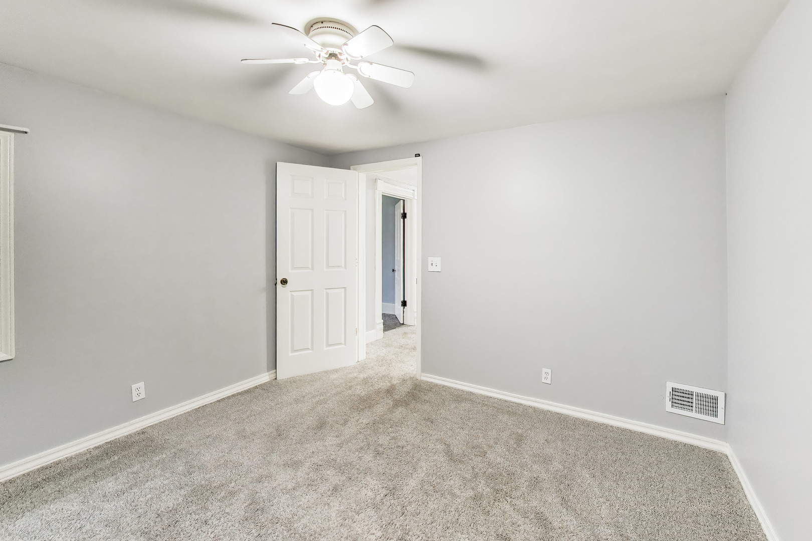 405 West Brown Street Harvard, IL 60033 - Photo 11 of 24 an empty room with closet and a ceiling fan