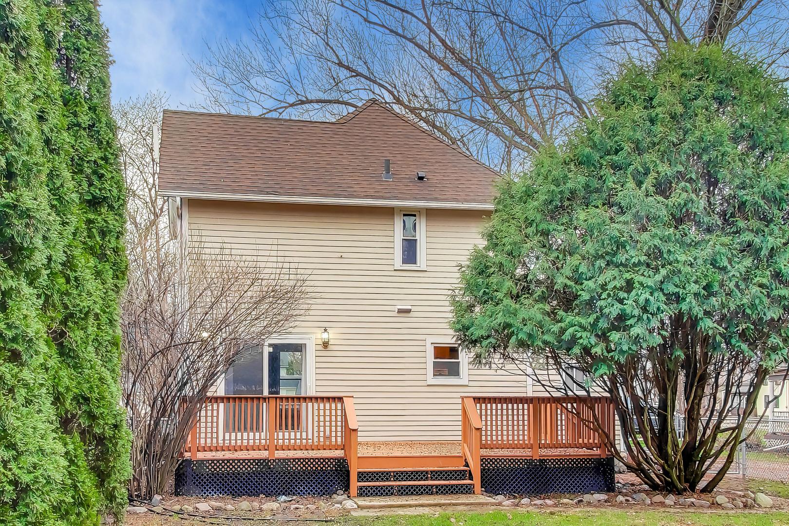 405 West Brown Street Harvard, IL 60033 - Photo 15 of 24 a view of a house with a tree