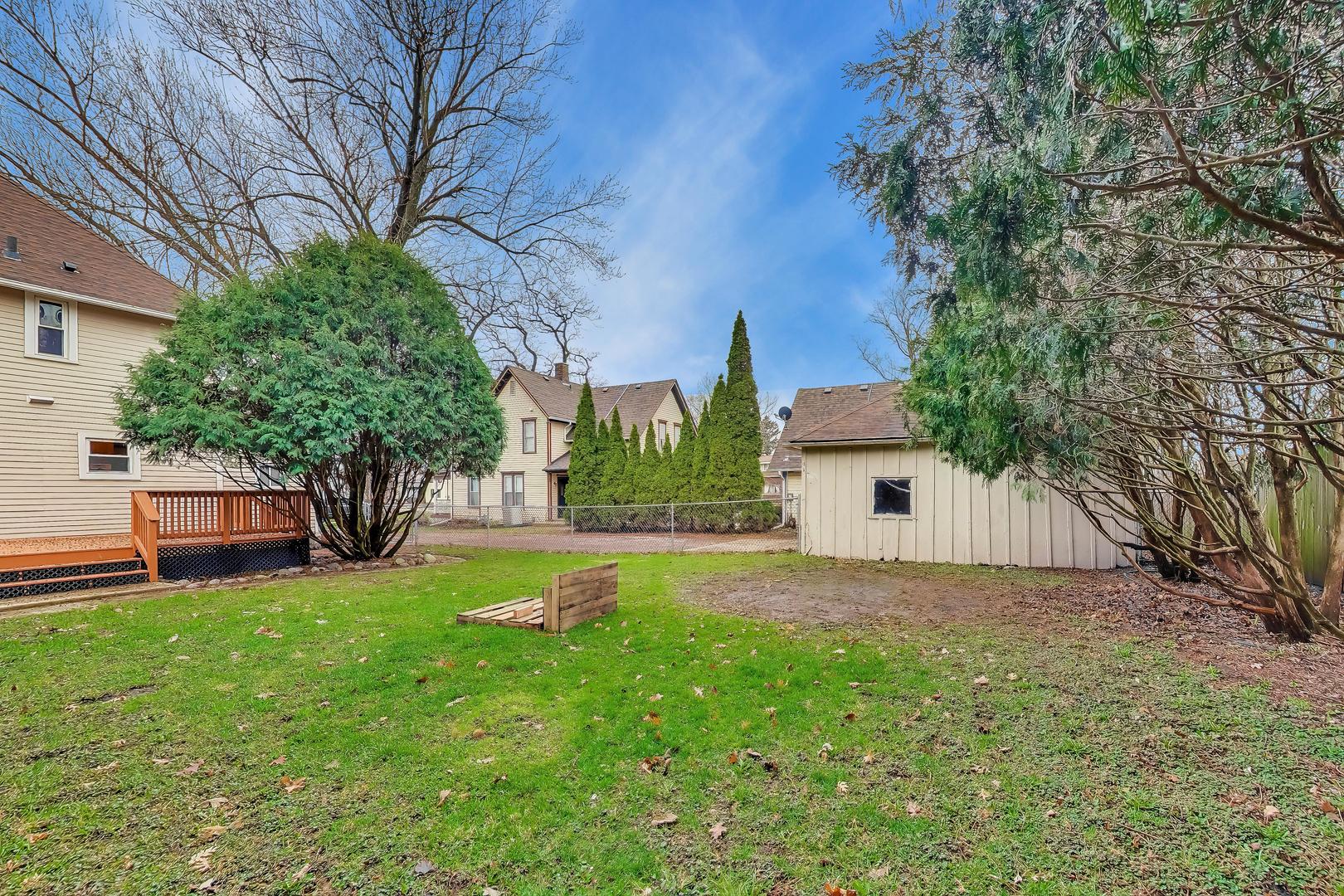 405 West Brown Street Harvard, IL 60033 - Photo 17 of 24 a view of a house with a yard