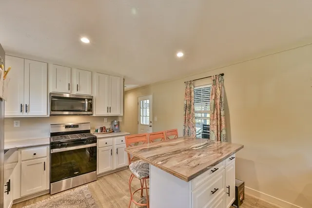 a living room with furniture and flat screen tv