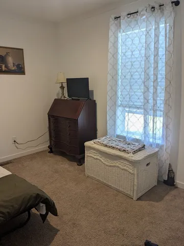 a bathroom with a toilet a sink and a mirror