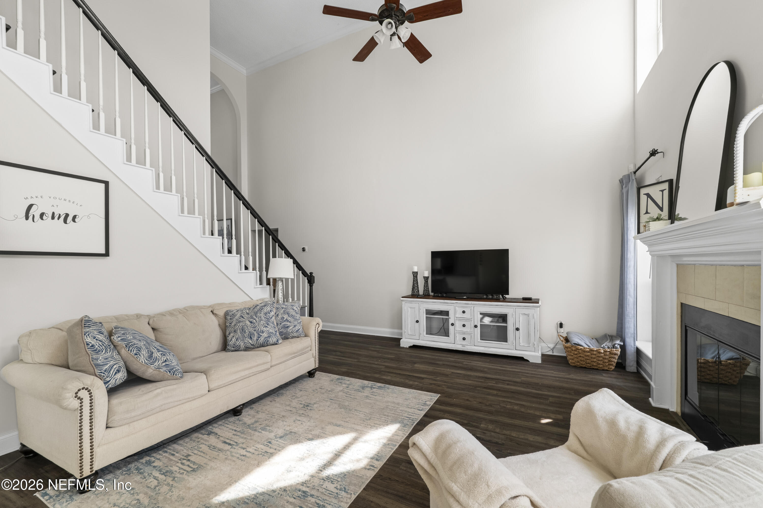 3734 Reedpond Drive North Jacksonville, FL 32223 - Photo 12 of 55 a living room with furniture a fireplace and a flat screen tv