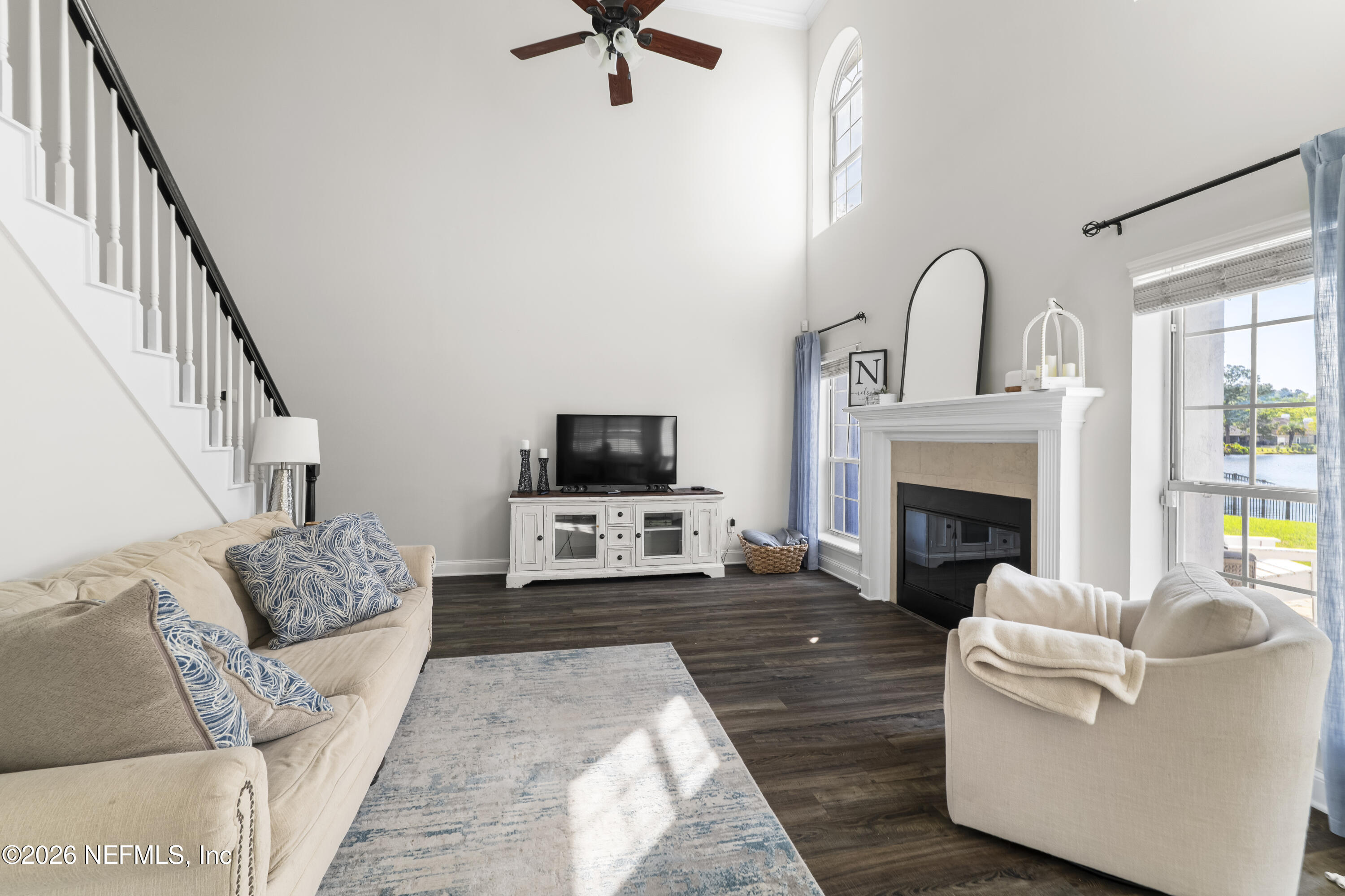 3734 Reedpond Drive North Jacksonville, FL 32223 - Photo 13 of 55 a living room with furniture a fireplace and a flat screen tv