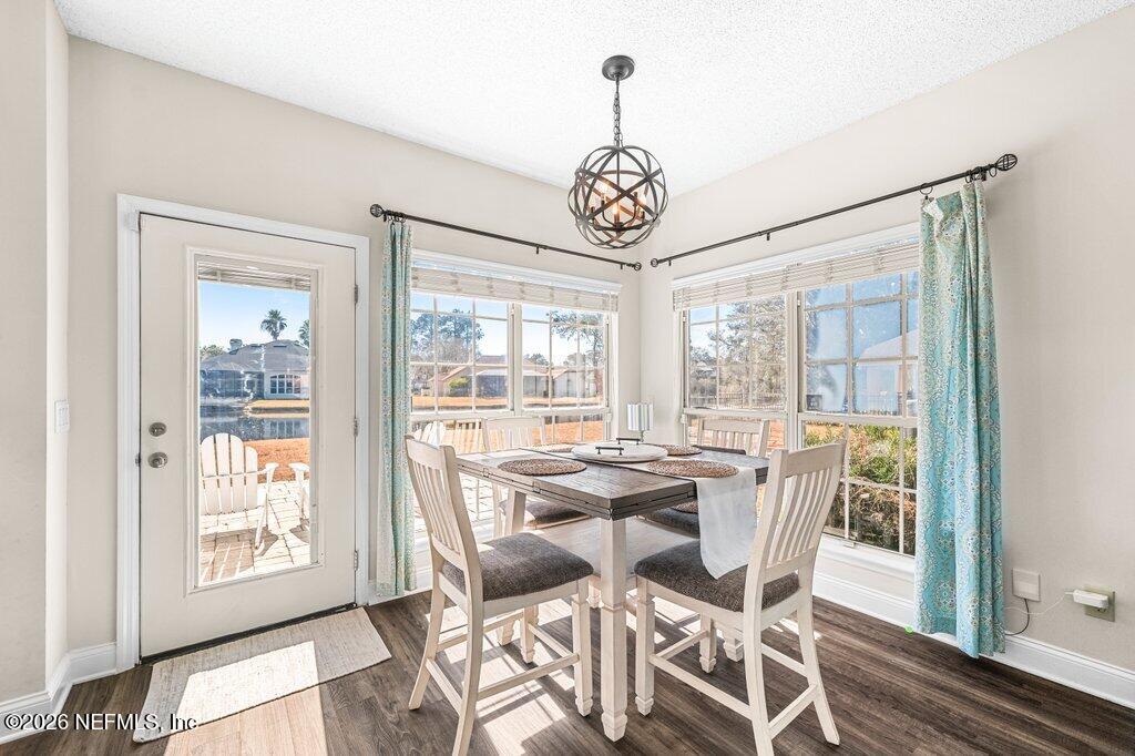 3734 Reedpond Drive North Jacksonville, FL 32223 - Photo 17 of 55 a view of a dining room with furniture window and wooden floor