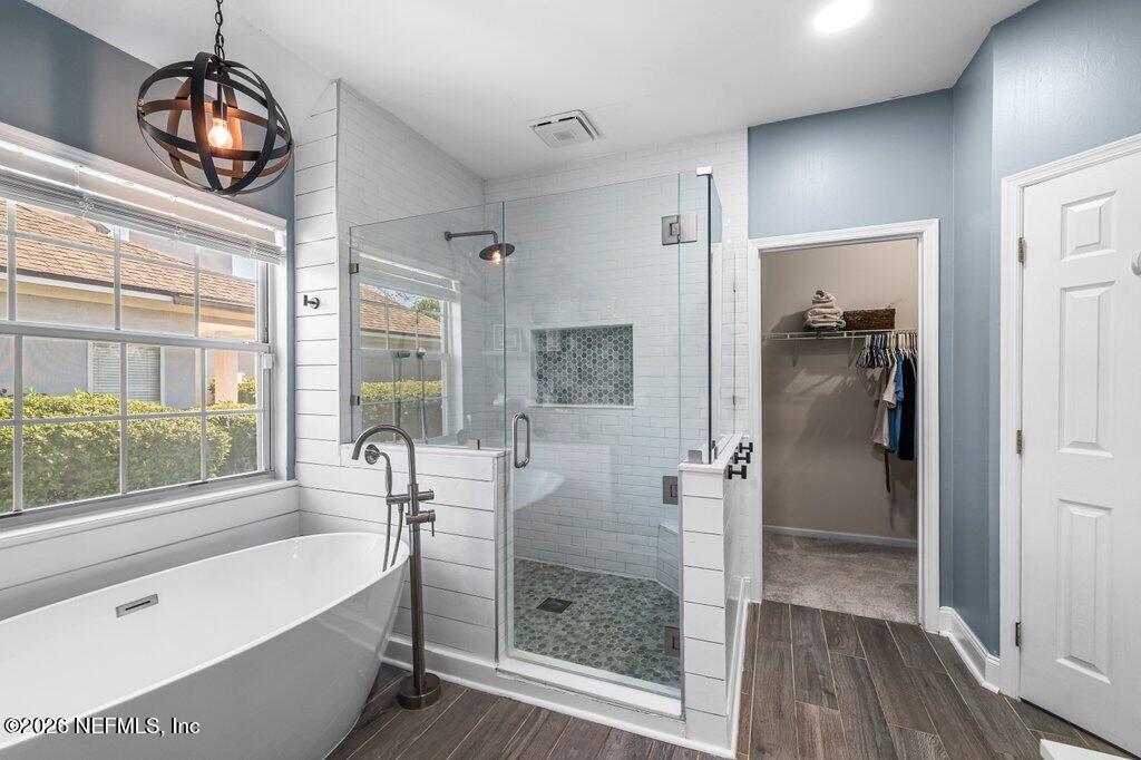 3734 Reedpond Drive North Jacksonville, FL 32223 - Photo 27 of 55 a bathroom with a bathtub and a shower