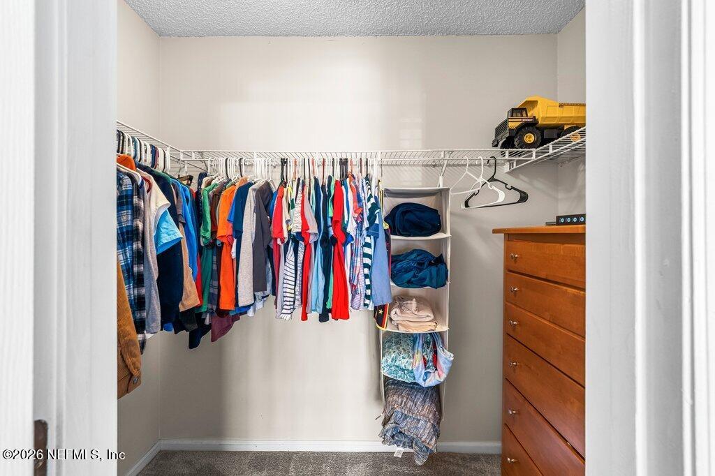 3734 Reedpond Drive North Jacksonville, FL 32223 - Photo 33 of 55 a view of walk in closet with clothes and shoes