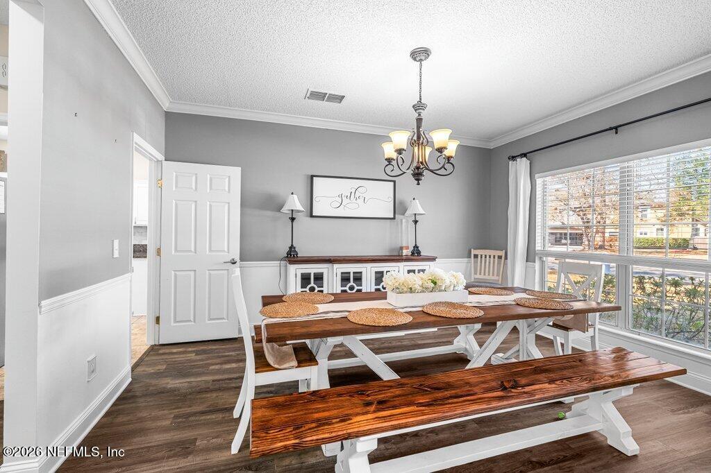 3734 Reedpond Drive North Jacksonville, FL 32223 - Photo 7 of 55 a view of a dining room with furniture window and wooden floor