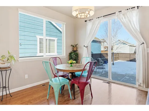 a view of a dining room with furniture and window