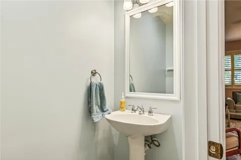 a bathroom with a sink and mirror