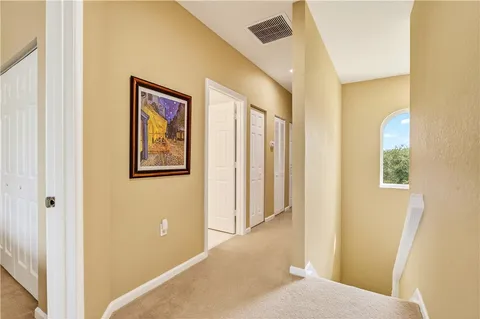 a view of a hallway to a bedroom