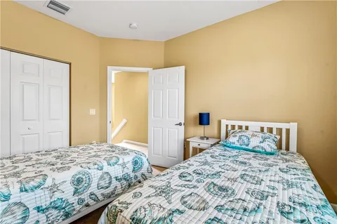 a bedroom with a bed and walk in closet