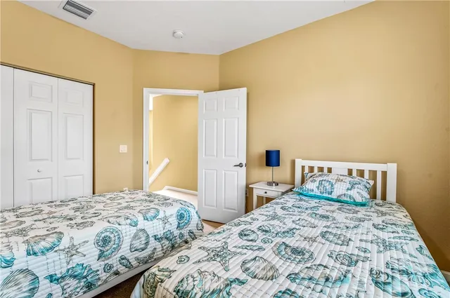 a bedroom with a bed and walk in closet