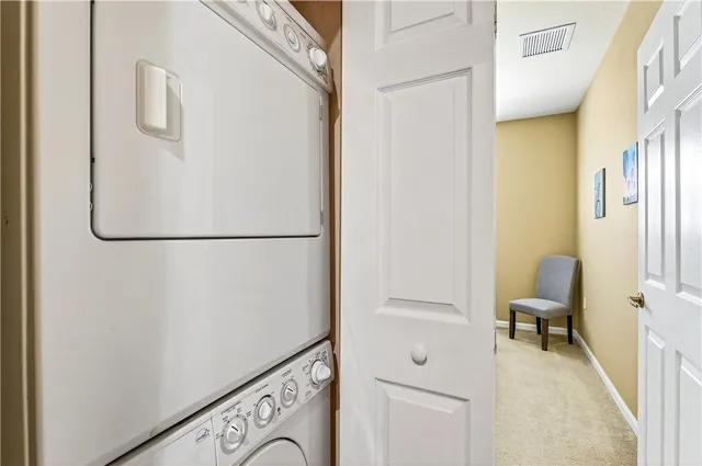 a view of a porch with furniture and garden