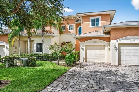 a view of a swimming pool with a lounge chairs