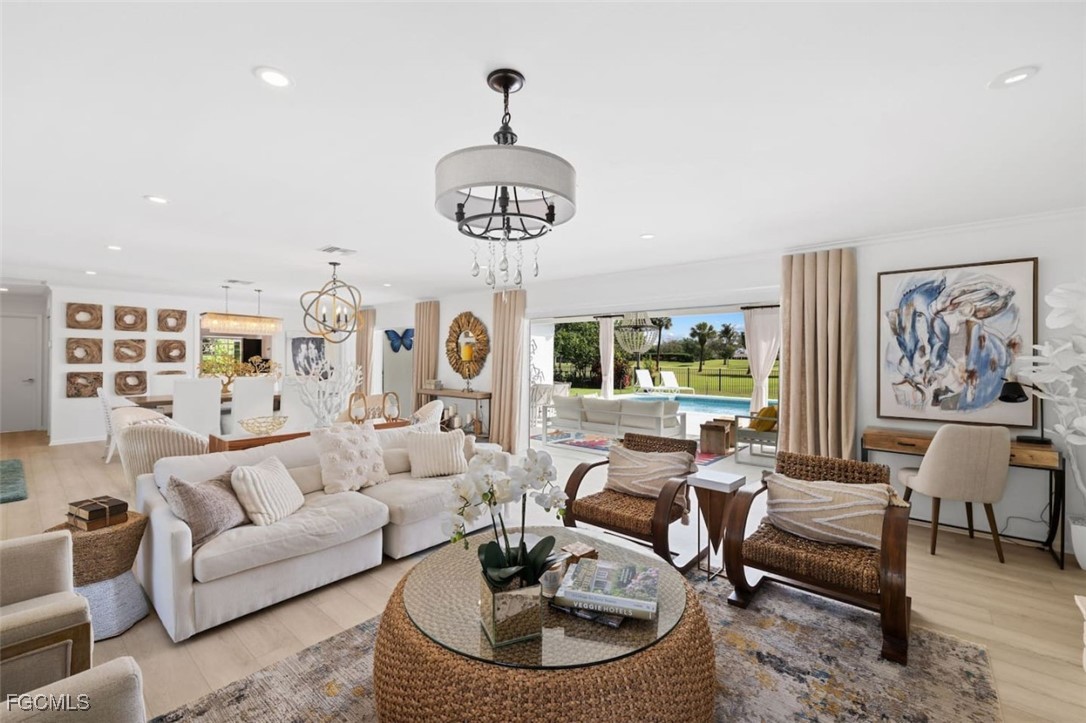 2728 Crayton Road Naples, FL 34103 - Photo 5 of 35 a living room with furniture