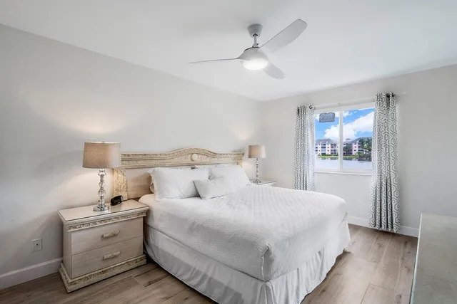 a large white bed in a white room