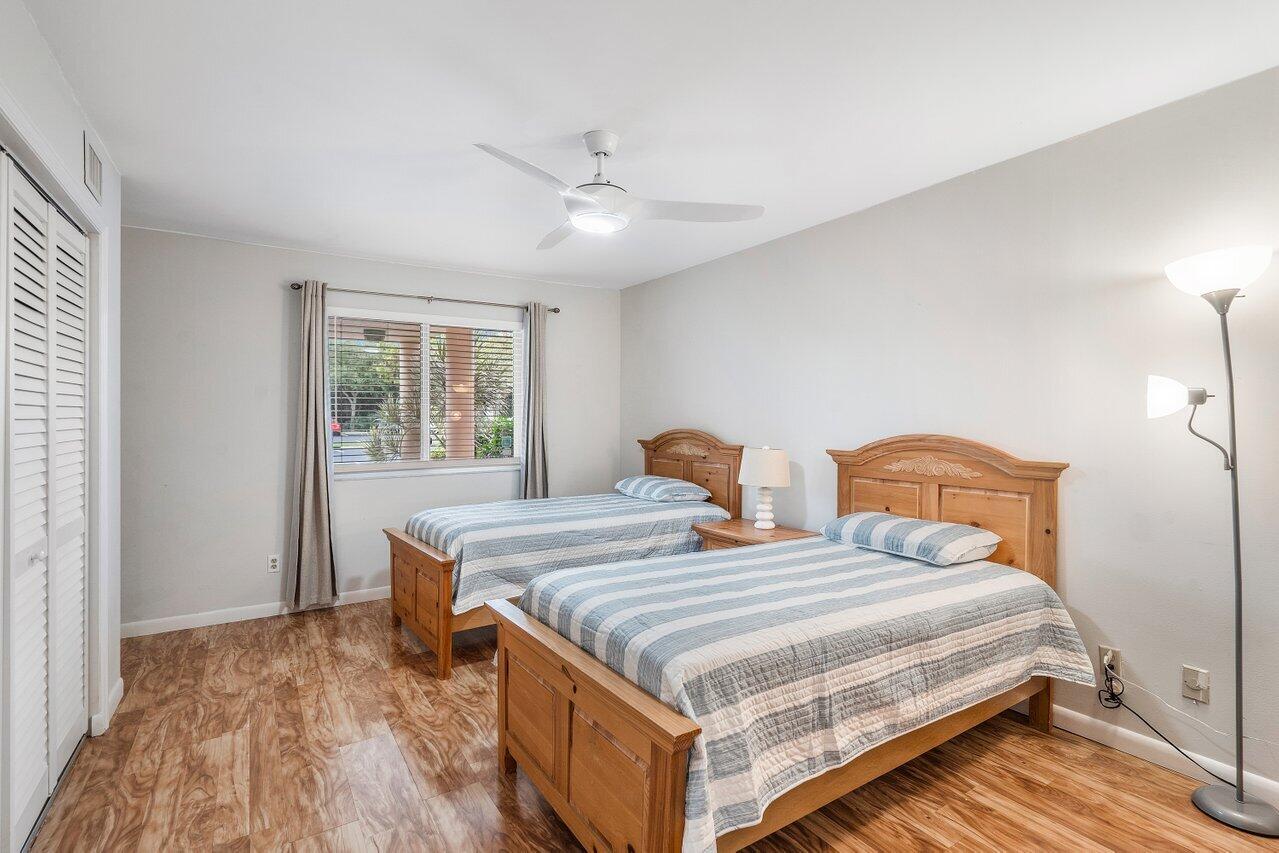 353 Highway 1, Unit F109 Jupiter, FL 33477 - Photo 16 of 22 a bedroom with two beds and a window