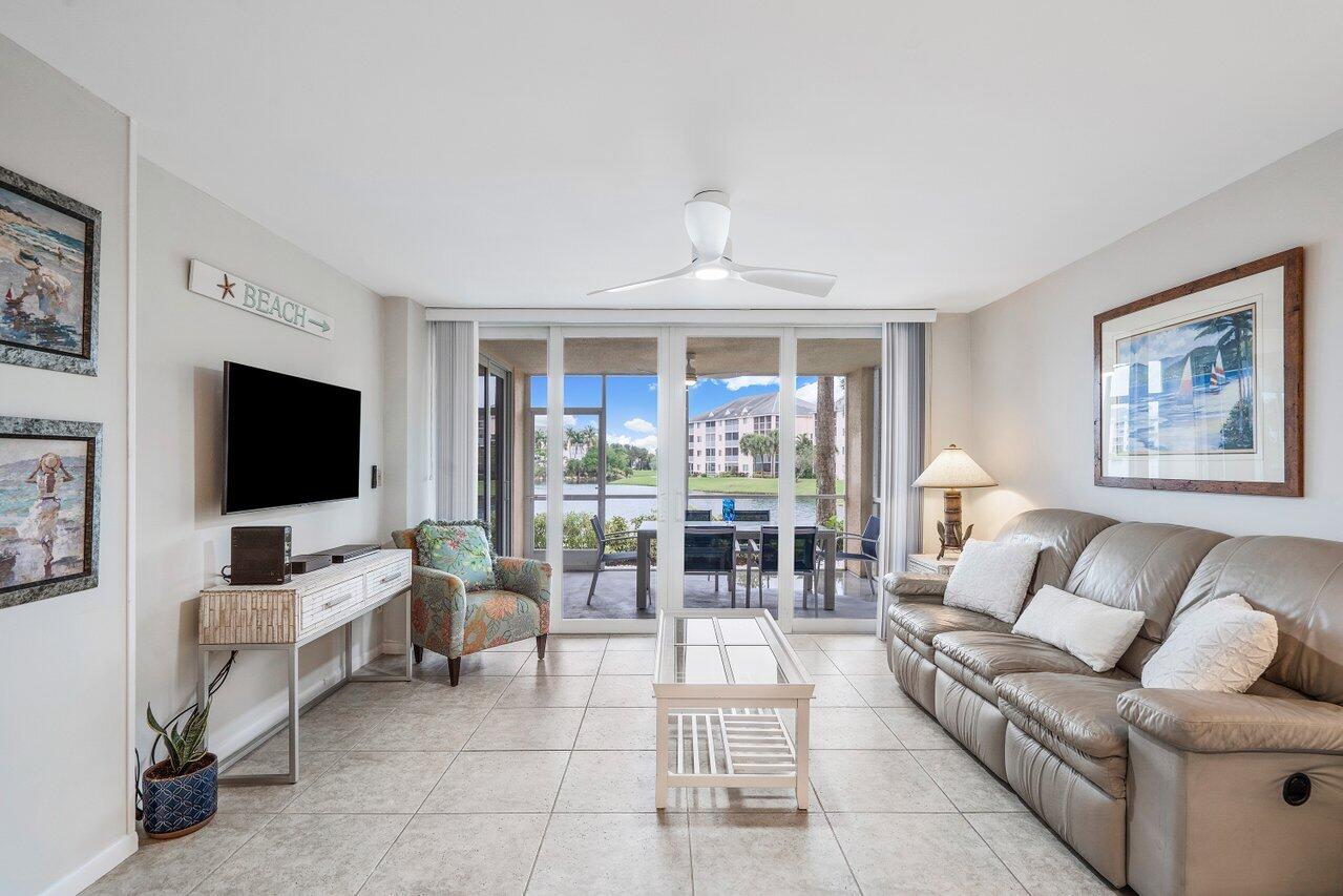 353 Highway 1, Unit F109 Jupiter, FL 33477 - Photo 6 of 22 a living room with furniture and a flat screen tv