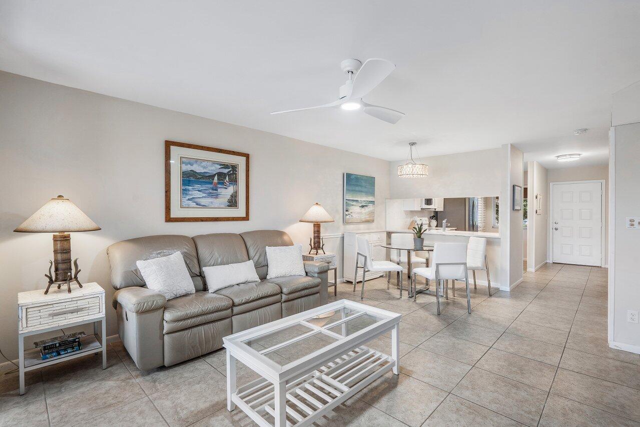 353 Highway 1, Unit F109 Jupiter, FL 33477 - Photo 8 of 22 a living room with furniture and a view of kitchen