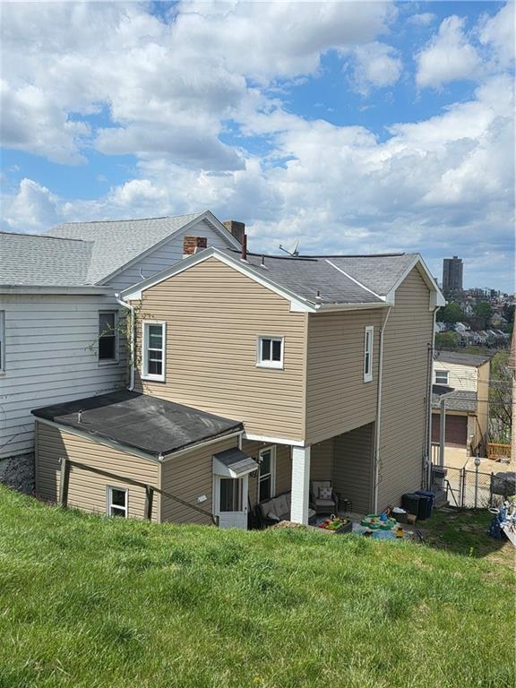 311 Natchez Street Pittsburgh, PA 15211 - Photo 9 of 12 a house view with a garden