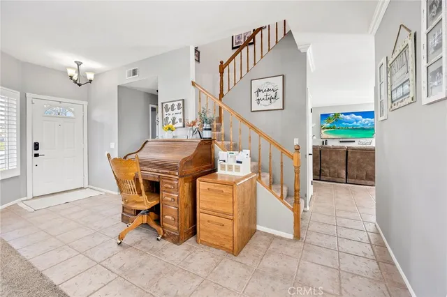 a view of a hallway with seating area