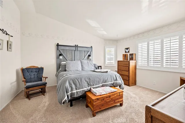 a bedroom with furniture and a window