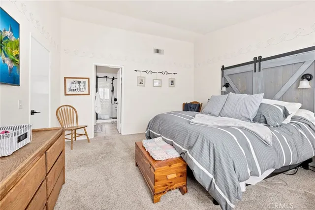 a bedroom with a bed and dresser