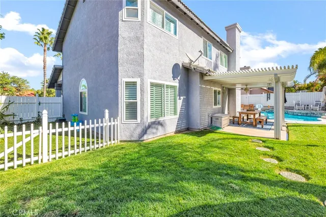 a view of a house with swimming pool and porch