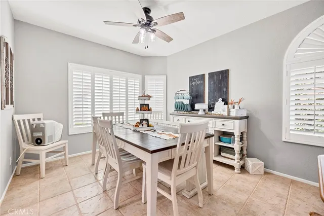 a view of a dining room with furniture and a window