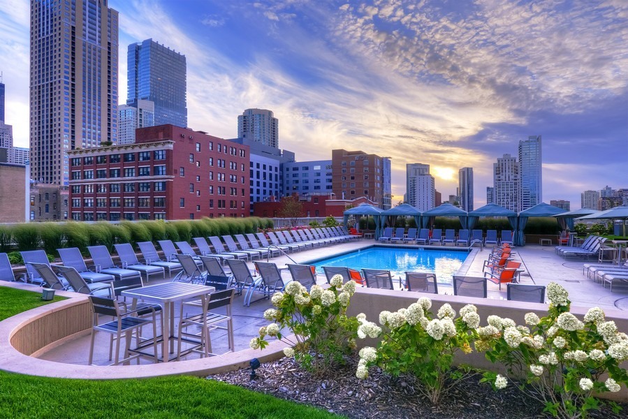 545 North Dearborn Street, Unit 1809 Chicago, IL 60654 - Photo 23 of 31 a view of a swimming pool with a table and chairs