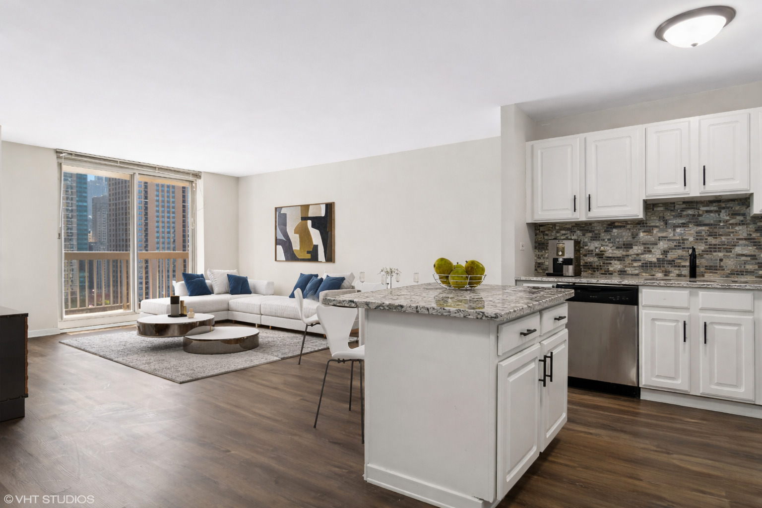 545 North Dearborn Street, Unit 1809 Chicago, IL 60654 - Photo 4 of 31 a kitchen with a sink cabinets and wooden floor