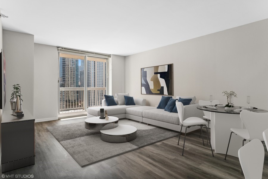 545 North Dearborn Street, Unit 1809 Chicago, IL 60654 - Photo 5 of 31 a living room with furniture and a large window