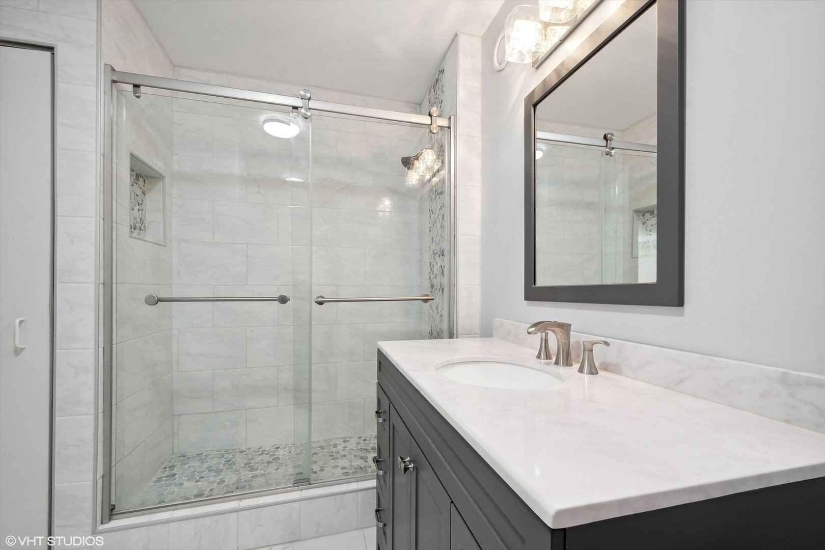 545 North Dearborn Street, Unit 1809 Chicago, IL 60654 - Photo 10 of 31 a bathroom with a sink vanity granite shower and a mirror
